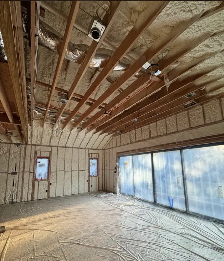 Interior walls and ceiling insulated with spray foam during new construction in Newington
